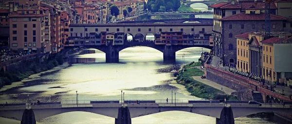 Bridges over the Arno River that crosses Florence in Italy with an antiqued effect