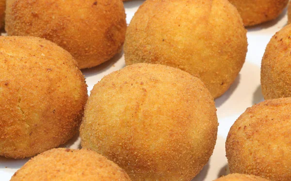 big balls of Rice deep fried for sale in Italy