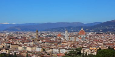 Wide View of City Florence in Central Italy with OLD PALACE and the Cathedral with Dome of Brunelleschi Architect and Italian Apennines Mountains in background