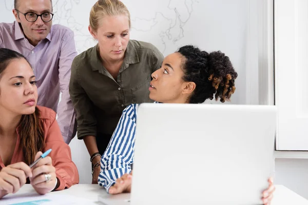 Business Team Gathered Laptop Office Discussing Something All Looking Gesturing — Stock Photo, Image