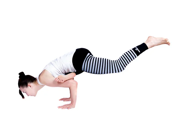 Chica joven realiza diferentes poses de yoga, modelo hermoso flexible sobre un fondo blanco. meditación y asanas . —  Fotos de Stock