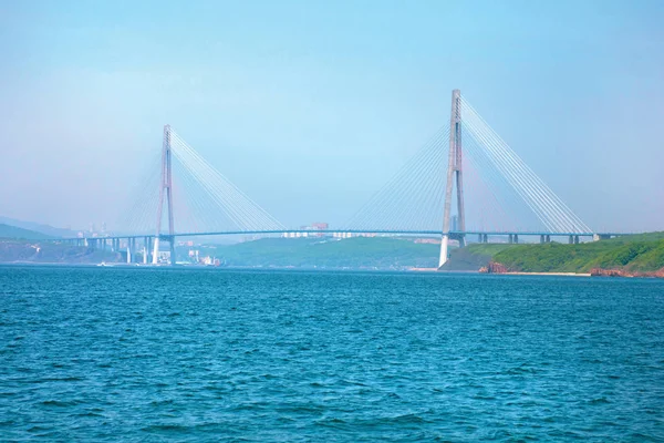 the bridge on the Russian island, picture the waterfront on a huge, high bridge.