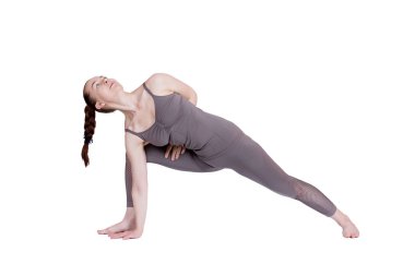 Genç kız Yoga, esnek güzel model beyaz bir arka plan üzerinde farklı pozlar gerçekleştirir. meditasyon ve asanas.