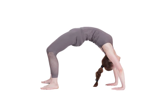 Jong meisje voert verschillende poses van yoga, flexibele mooie model op een witte achtergrond. meditatie en asana 's. — Stockfoto