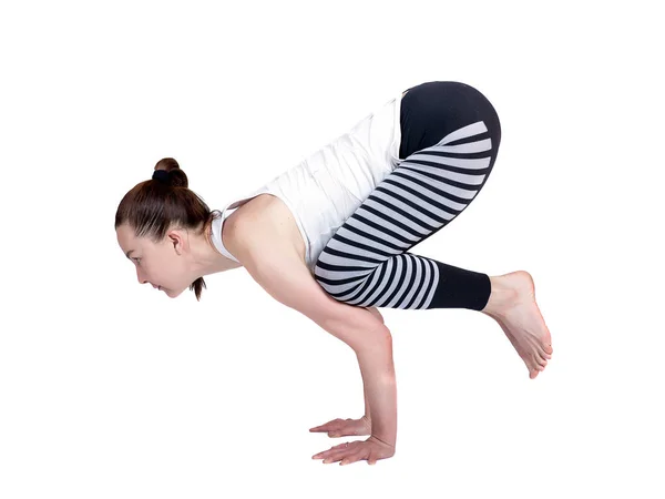 Chica joven realiza diferentes poses de yoga, modelo hermoso flexible sobre un fondo blanco. meditación y asanas . —  Fotos de Stock