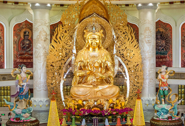 the Centre of Buddhism in Sanya. Temple with Lotus on the ceiling, Golden Buddha and many statues and goddesses.