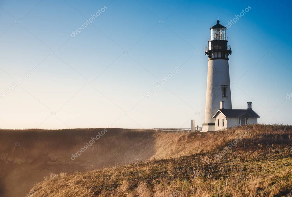 Photo of the yaquina Head Lighthouse at the Sunset time