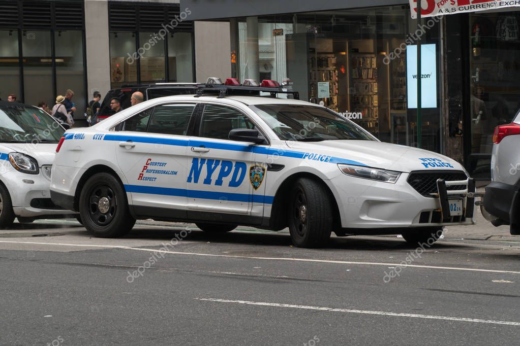 New York City, Circa 2019: NYPD police cruiser car parked on Manhattan road side responding to emergency situation person dial 911 for help and assistance