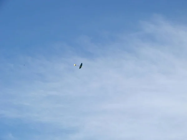 Radio controlled model airplane spiraling towards ground on blue sky. Aviation, airplanes, aerobatics and competition concepts — Stock Photo, Image