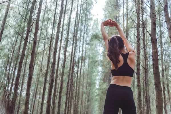 Women Stretching Arms Breathing Fresh Air Middle Pinewood Forest While — Stock Photo, Image