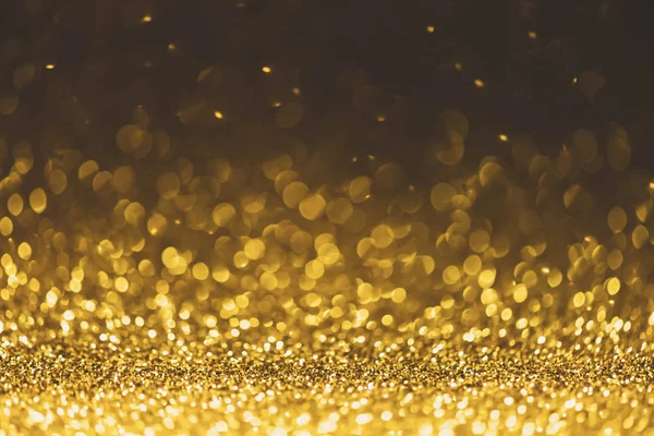 Latar belakang kilauan lampu emas. abstra glitter yang defocus — Stok Foto