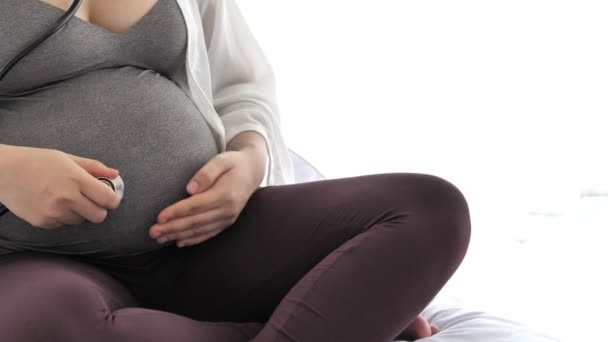 Close Footage Pregnant Woman Sitting Bed — Stock Video