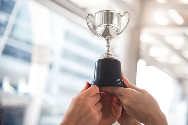 Champion silver trophy for runner up winner with sport player ha — Stock Photo, Image