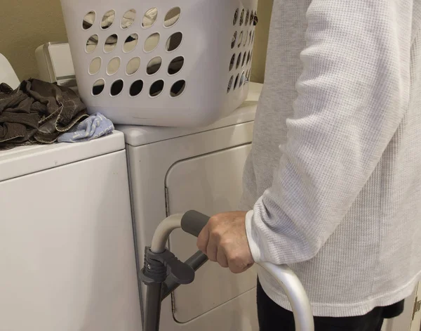 Clothes are being prepared for washing by a handicap person — Stock Photo, Image