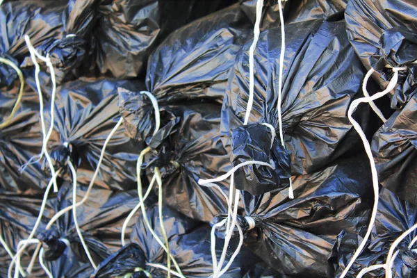 Black plastic bags. Close-up. Background. Texture.