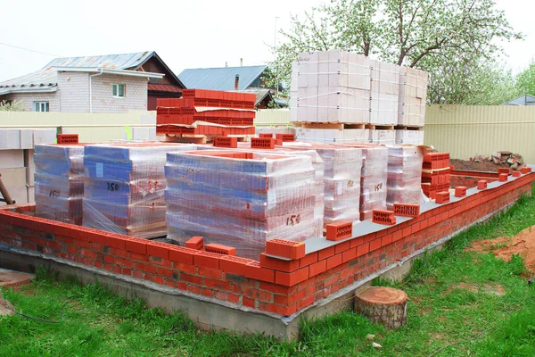 Construction of a brick house. Foundation and building materials. Background.