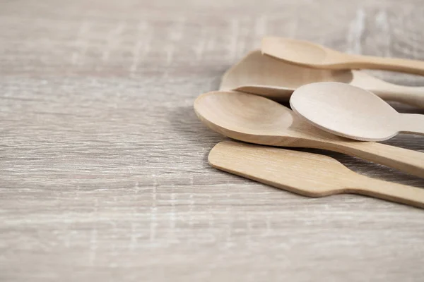 many wood spoons on brown table