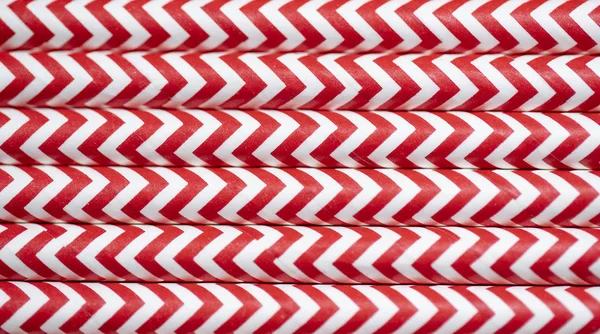 Close up red and white paper straws striped colorful  background