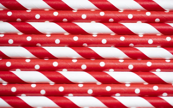 Close up red and white paper straws striped colorful  background