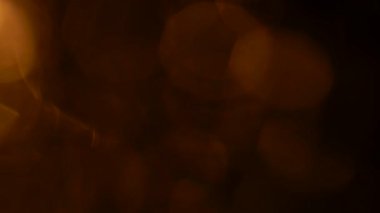 Golden bokeh lights light leak lens flare luxurious abstract overlay transition