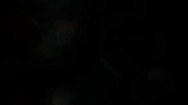 Golden bokeh lights light leak lens flare luxurious abstract overlay transition