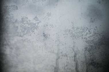 Soyut doku, pasaklı, cesur, kirli arka plan. Doku, eski kirli bir pencereye yakından odaklanarak, makro lens kullanarak elde edilir..