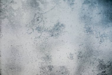 Soyut doku, pasaklı, cesur, kirli arka plan. Doku, eski kirli bir pencereye yakından odaklanarak, makro lens kullanarak elde edilir..