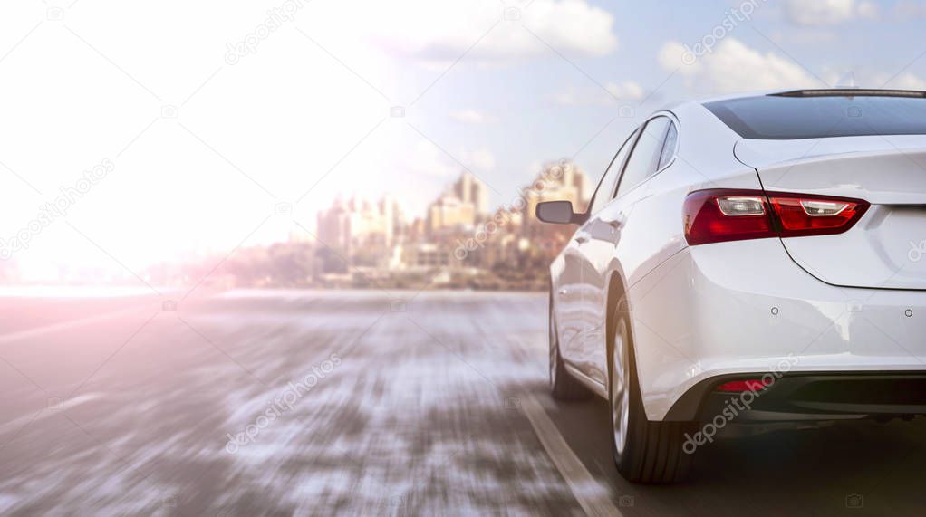 white business car moving on highway