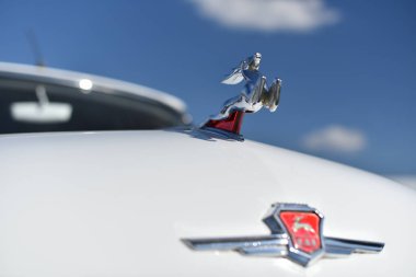 Kiev / Ukraine - 04.28.18: Running deer - the brand logo of the automaker GAZ on bonnet of car Gaz 21 (Volga)