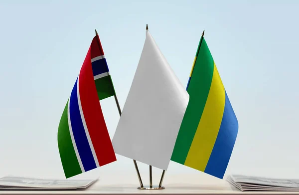 Gambia Gabon Fehér Zászló Standon Papírokkal — Stock Fotó