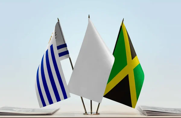 Bandeiras Jamaica Uruguai Stand Com Papéis — Fotografia de Stock