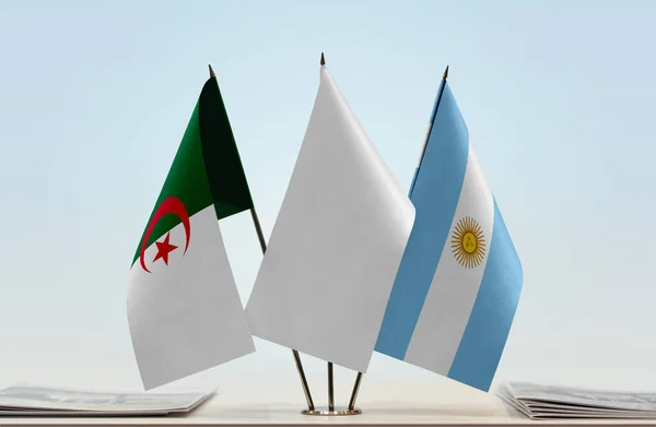 Algeria, Argentina and white flags on stand with papers