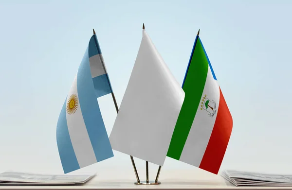 Argentina Equatorial Guinea flags on stand with papers