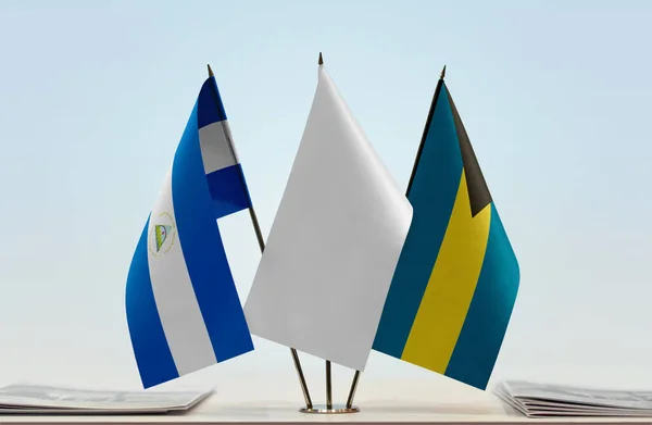 Bahamas Nicaragua Flags Stand Papers — Stock Photo, Image
