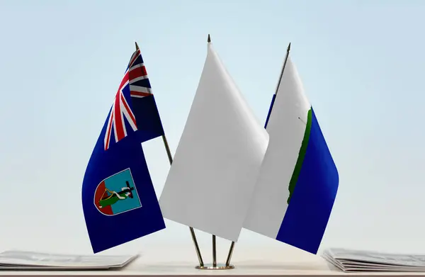 Montserrat Isla Navassa Banderas Stand Con Papeles —  Fotos de Stock