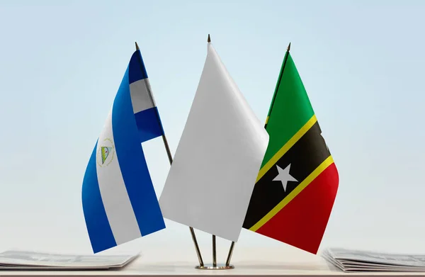 Saint Kitts Nevis Nicaragua Vlaggen Standaard Met Papieren — Stockfoto