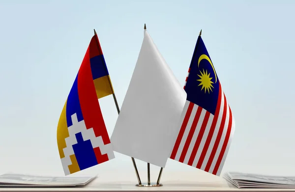 Nagorno-Karabakh Malaysia and white flags on stand with papers