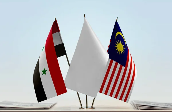 Syria Malaysia and white flags on stand with papers