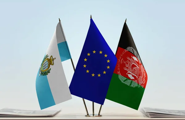 San Marino Afghanistan and eu flag on stand with papers