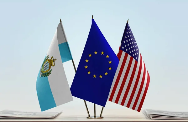 San Marino USA and eu flag on stand with papers