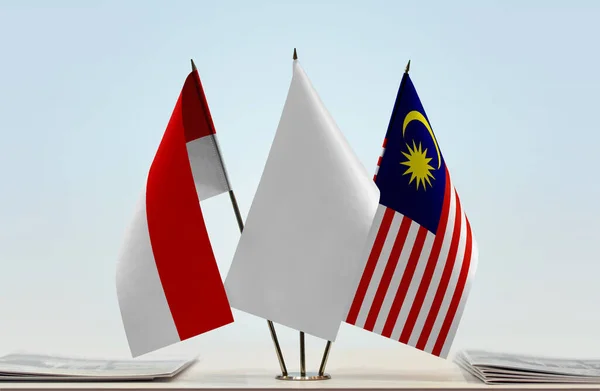 Indonesia Malaysia White Flags Stand Newspapers Table — Stock Photo, Image