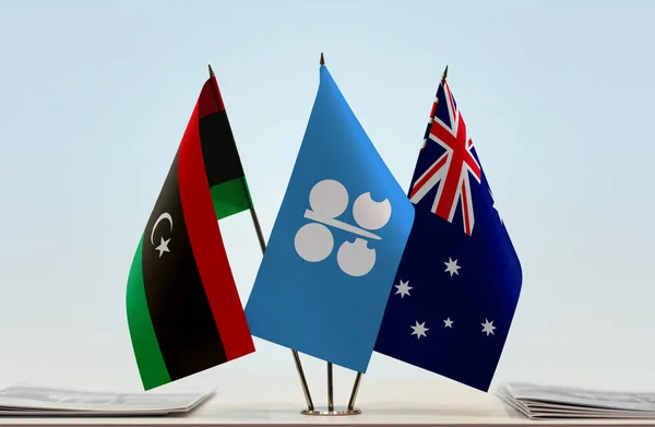 Libya Australia flags on stand with papers