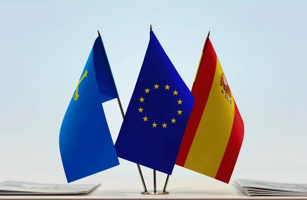 stock image Asturias Spain EU flags on stand with papers