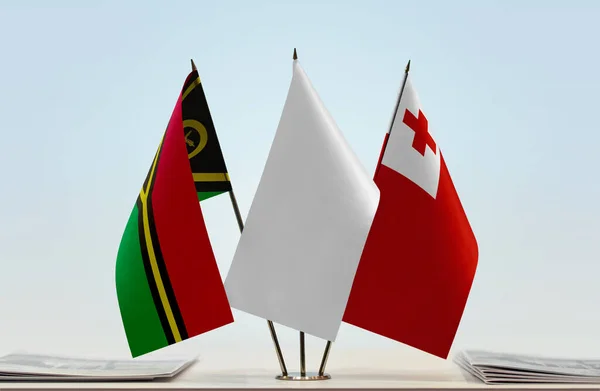 Vanuatu Tonga flags on stand with papers