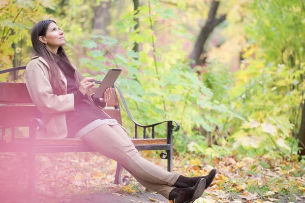 Woman Using Digital Tablet Sitting Autumn Park — Stock Photo, Image