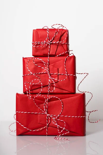 Christmas Gift Boxes Wrapped Red Paper Bow Dtriped Rope White — Stock Photo, Image