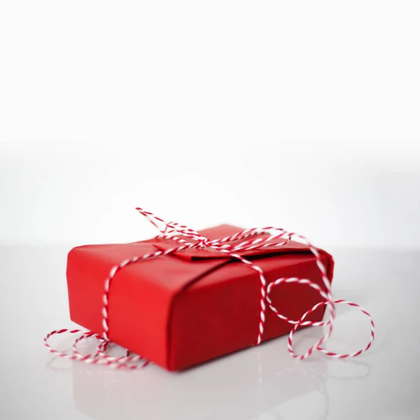 Christmas Gift Box Wrapped Red Paper Bow Dtriped Rope White — Stock Photo, Image