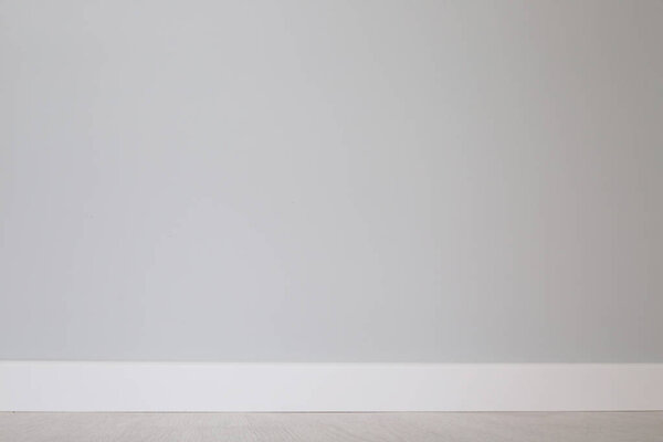 Empty wall and floor background of scandinavian room interior with white plinth close up , copy space for text , renovation , new home ownership concept