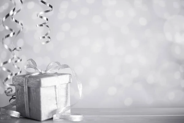 Silver Christmas gift with ribbon — Stock Photo, Image