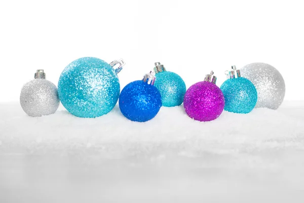 Christmas balls on snow isolated — Stock Photo, Image